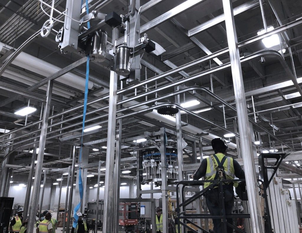 ProFab workers installing new equipment in a food processing facility after a food safety crisis